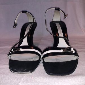 Black heel with white strap